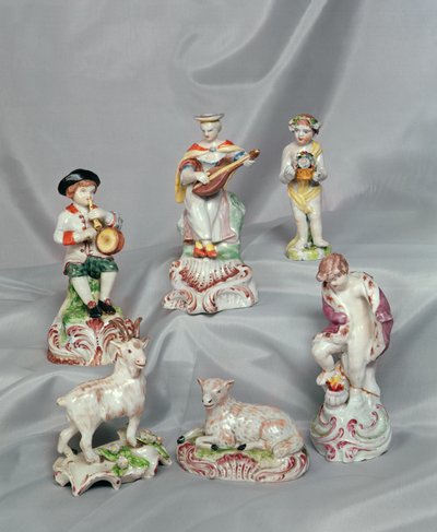 Boy playing pipe and tabor, girl playing the lute, Cupid holding basket, goat, sheep and figure of winter by English School